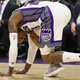 For added discomfort, the guy in the purple socks and tie is... Kevin Johnson!